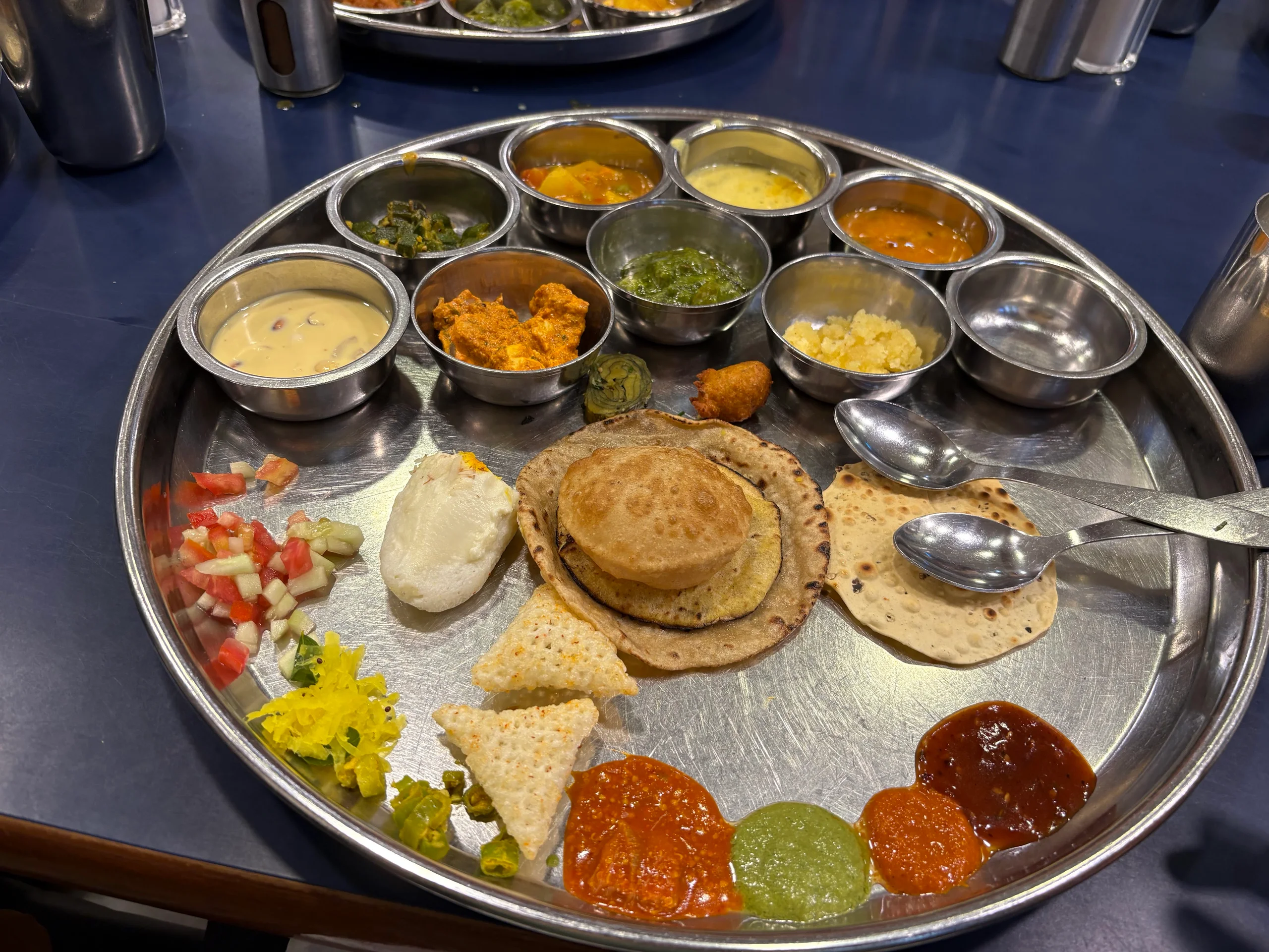 A full Gujarati thali with rotli, farsan, sabzi and chutneys at Shree Thaker Bhojanalay, Kalbadevi, Mumbai